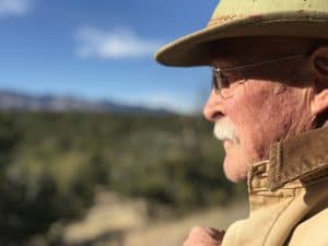 A mountain man contemplates in nature